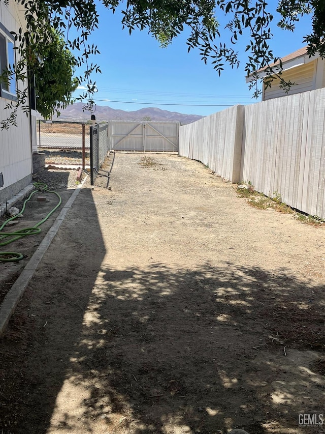 214 Buchanan St, Taft, CA 93268 - view of yard featuring a gate