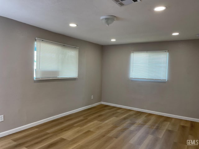 214 Buchanan St, Taft, CA 93268 - spare room featuring wood finished floors, baseboards, and recessed lighting