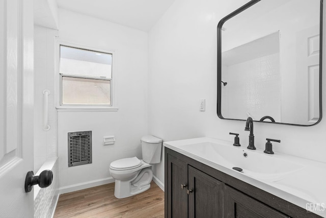 1920 Doolittle Ave, Bakersfield, CA 93304 - full bathroom featuring vanity, toilet, heating unit, wood finished floors, and a shower