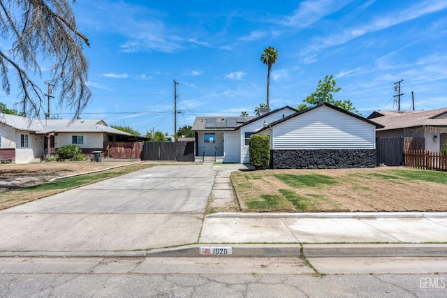 1920 Doolittle Ave, Bakersfield, CA 93304 - view of front facade featuring solar panels and concrete driveway