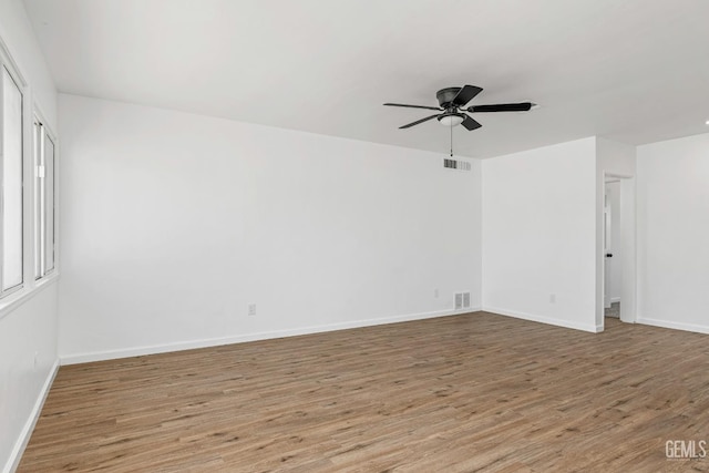 1920 Doolittle Ave, Bakersfield, CA 93304 - unfurnished room with ceiling fan, wood finished floors, and baseboards