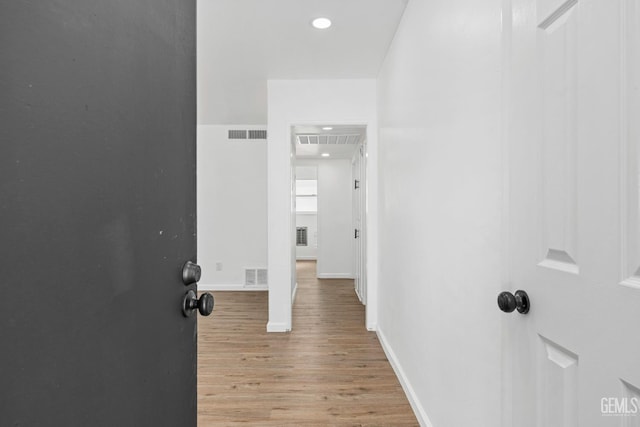 1920 Doolittle Ave, Bakersfield, CA 93304 - hallway featuring light wood finished floors, baseboards, and recessed lighting