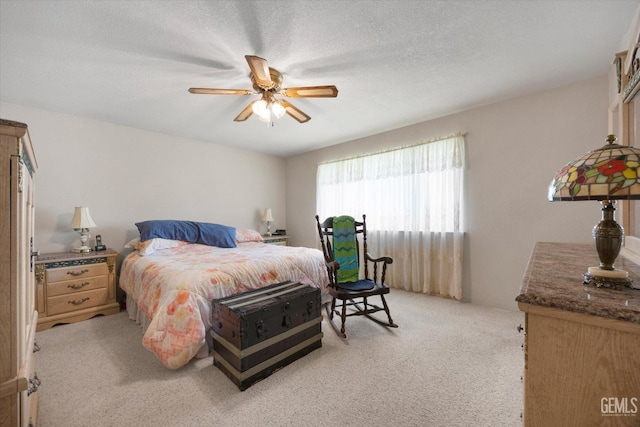 bedroom with light colored carpet and ceiling fan