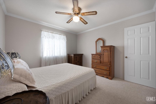 bedroom featuring light colored carpet, crown molding, and a ceiling fan