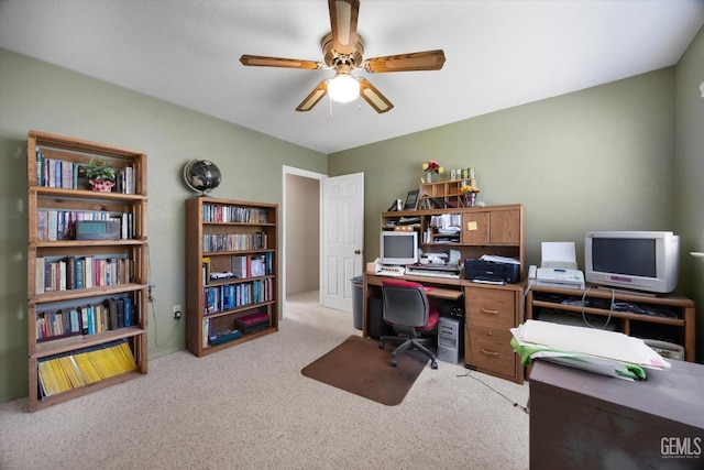 office featuring ceiling fan and light carpet