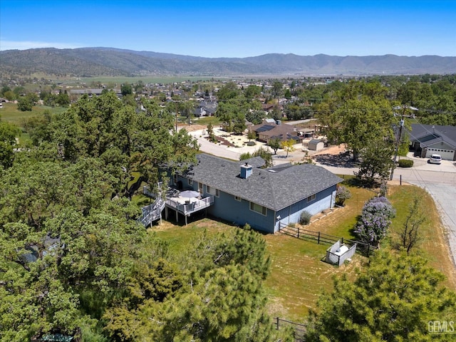 view from above of property with a mountain backdrop