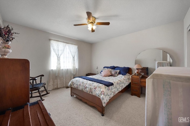 bedroom featuring ceiling fan and carpet flooring
