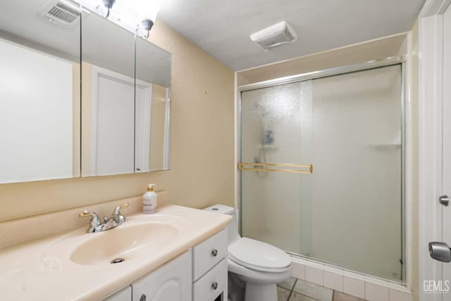 3717 Cypress Glen Blvd, Bakersfield, CA 93309 - bathroom featuring a shower stall, vanity, toilet, and tile patterned floors