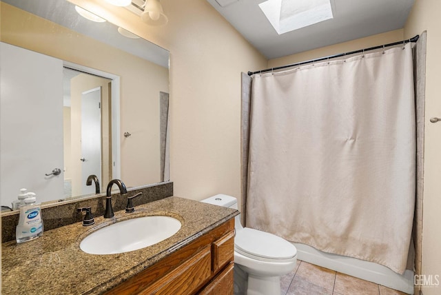 3717 Cypress Glen Blvd, Bakersfield, CA 93309 - bathroom featuring a skylight, tile patterned floors, toilet, vanity, and shower / bathtub combination with curtain