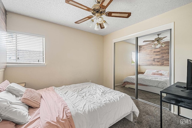 3717 Cypress Glen Blvd, Bakersfield, CA 93309 - carpeted bedroom featuring a closet, a textured ceiling, and a ceiling fan