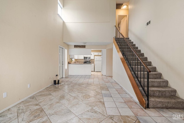 3717 Cypress Glen Blvd, Bakersfield, CA 93309 - stairs with a towering ceiling and baseboards