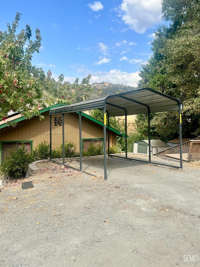 view of parking / parking lot with a carport