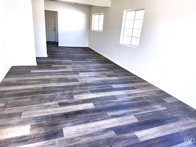 unfurnished room featuring dark wood-type flooring