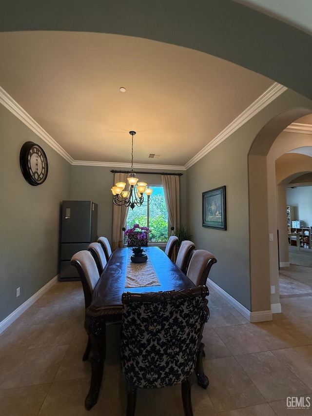 2410 Exton St, Bakersfield, CA 93311 - dining room with a chandelier, ornamental molding, arched walkways, and tile patterned floors