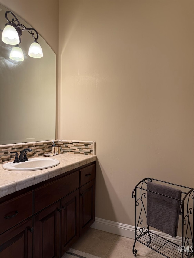 2410 Exton St, Bakersfield, CA 93311 - bathroom featuring vanity, backsplash, and tile patterned flooring