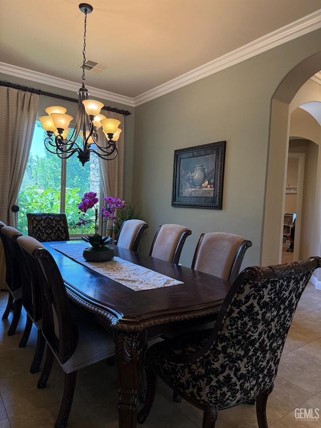 2410 Exton St, Bakersfield, CA 93311 - dining space with arched walkways, a chandelier, crown molding, and light tile patterned floors