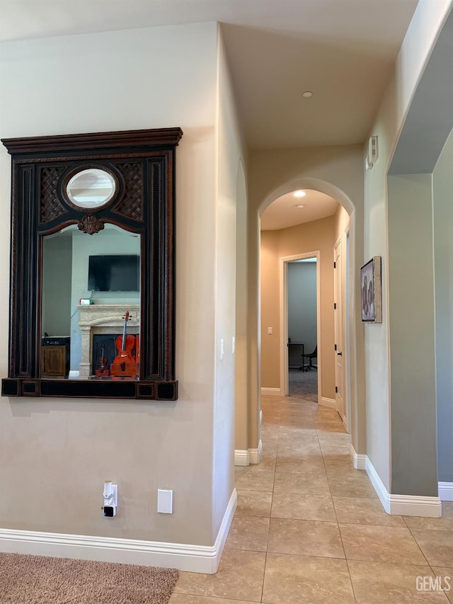 2410 Exton St, Bakersfield, CA 93311 - corridor with arched walkways and tile patterned flooring