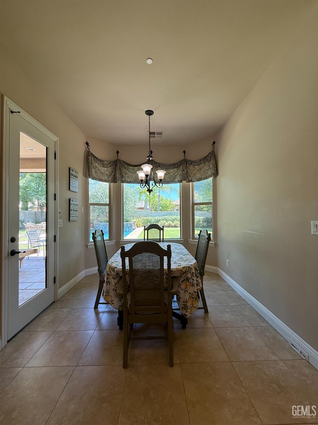 2410 Exton St, Bakersfield, CA 93311 - dining room featuring plenty of natural light, a chandelier, and light tile patterned floors