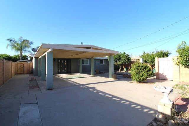 118 W 20th Ave, Delano, CA 93215 - rear view of property featuring a carport and driveway