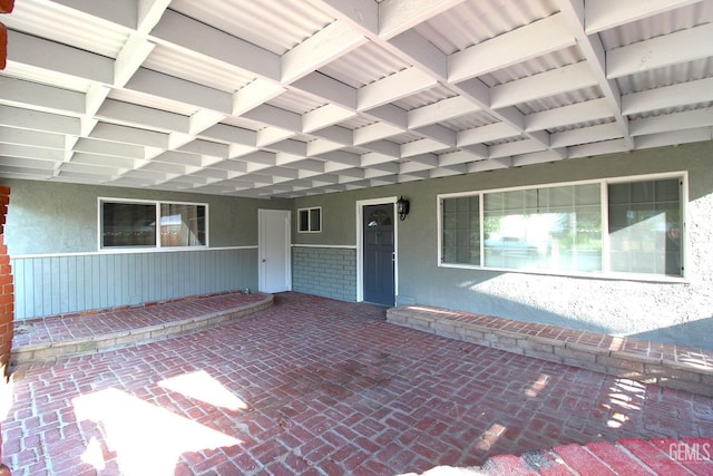 118 W 20th Ave, Delano, CA 93215 - doorway to property featuring stucco siding and a porch