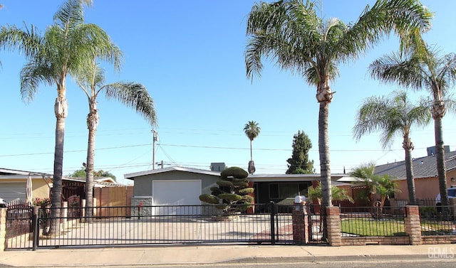 118 W 20th Ave, Delano, CA 93215 - ranch-style house with concrete driveway, an attached garage, a fenced front yard, and stucco siding
