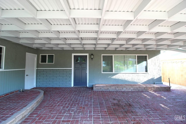 118 W 20th Ave, Delano, CA 93215 - view of exterior entry featuring stucco siding and a porch