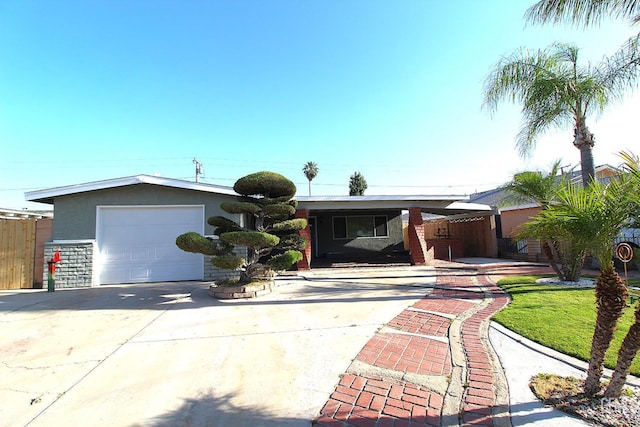 118 W 20th Ave, Delano, CA 93215 - ranch-style home with concrete driveway, stucco siding, and a garage