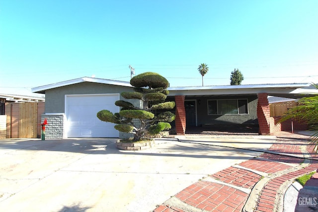 118 W 20th Ave, Delano, CA 93215 - ranch-style house featuring concrete driveway, stucco siding, and a garage