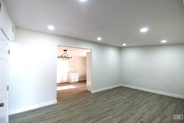 118 W 20th Ave, Delano, CA 93215 - empty room with wood finished floors, recessed lighting, and baseboards