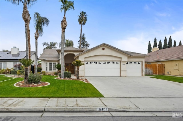 view of front facade featuring a front yard and a garage