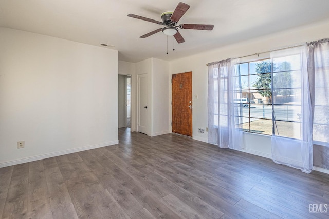 unfurnished room with ceiling fan and hardwood / wood-style flooring