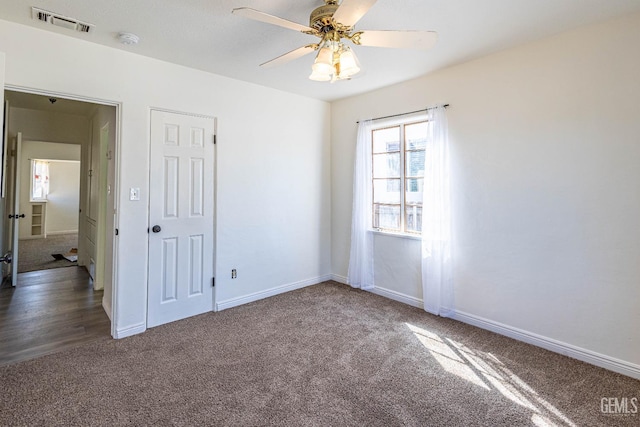 carpeted empty room with ceiling fan