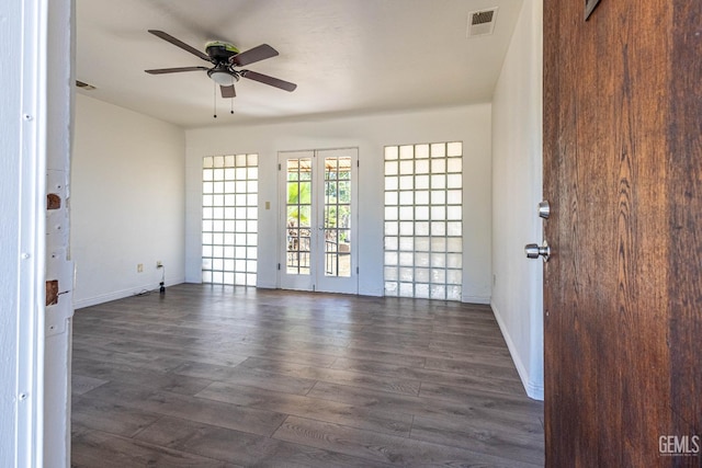 spare room with french doors, dark hardwood / wood-style flooring, and ceiling fan