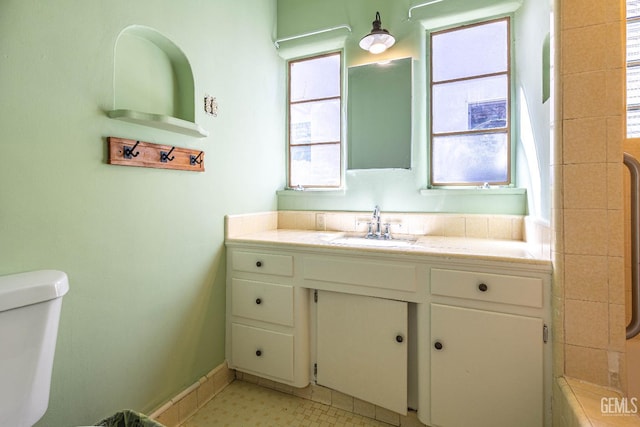 bathroom featuring vanity and toilet