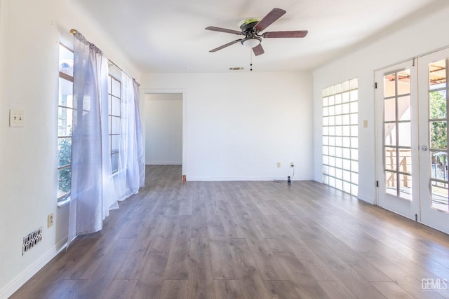 spare room featuring french doors, hardwood / wood-style flooring, and ceiling fan