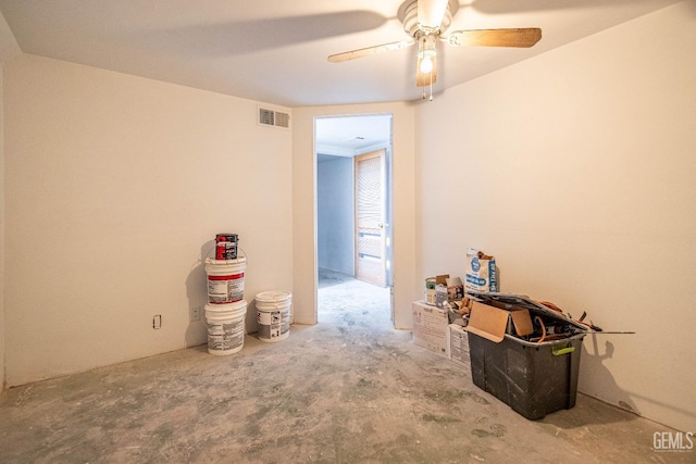 unfurnished room featuring ceiling fan and concrete floors