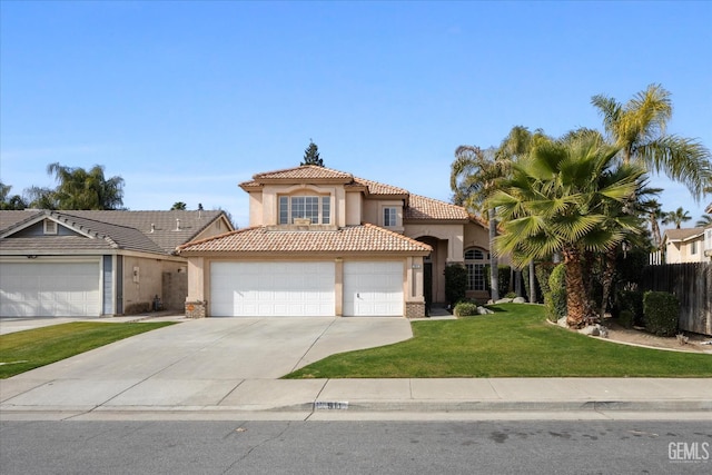 mediterranean / spanish house featuring a front lawn