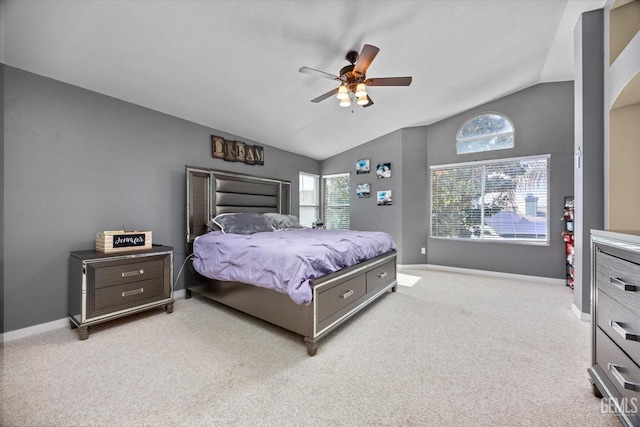 carpeted bedroom featuring ceiling fan and vaulted ceiling