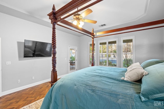 bedroom with ceiling fan and parquet flooring