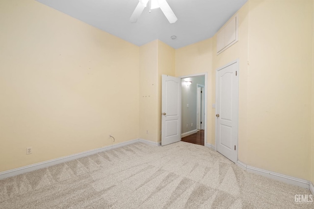 spare room with ceiling fan and carpet floors