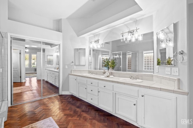 bathroom featuring vanity, parquet flooring, and ceiling fan