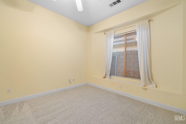 unfurnished room featuring ceiling fan and carpet flooring