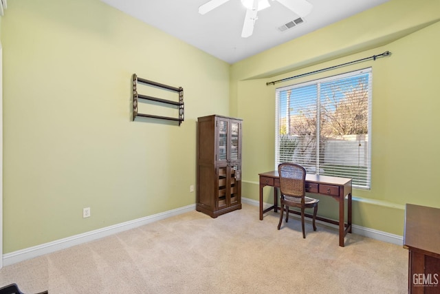 office space featuring light colored carpet and ceiling fan