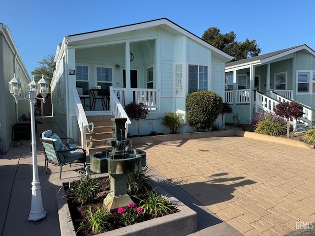 manufactured / mobile home with a porch