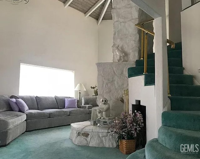 24551 Pueblo Ct, Tehachapi, CA 93561 - living area with stairway, a fireplace with raised hearth, high vaulted ceiling, carpet floors, and a wood ceiling with exposed beams