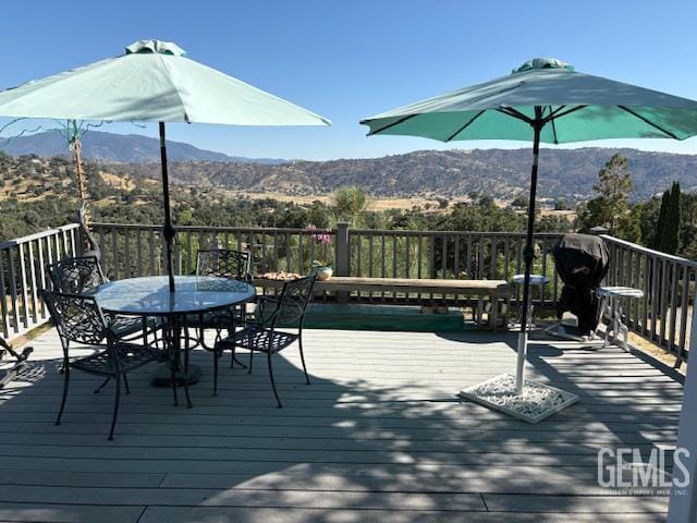 24551 Pueblo Ct, Tehachapi, CA 93561 - wooden terrace with a mountain view and outdoor dining space