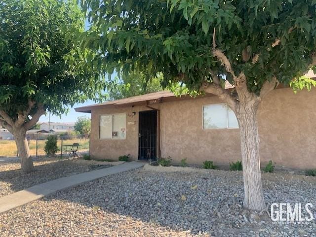 305 Monroe St Unit C, Taft, CA 93268 - view of front facade with stucco siding