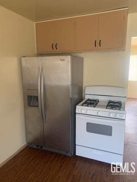 305 Monroe St Unit C, Taft, CA 93268 - kitchen featuring gas range gas stove, stainless steel refrigerator with ice dispenser, and dark wood-style floors