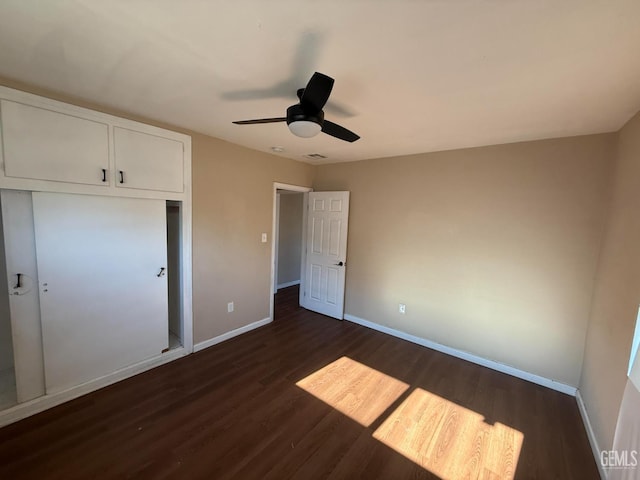 3820 Apache Ave, Bakersfield, CA 93309 - unfurnished bedroom featuring dark wood finished floors, a closet, and a ceiling fan