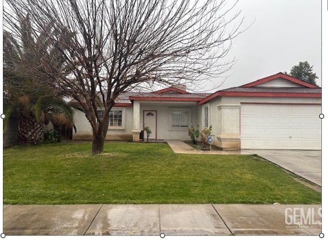 ranch-style house with a garage and a front lawn